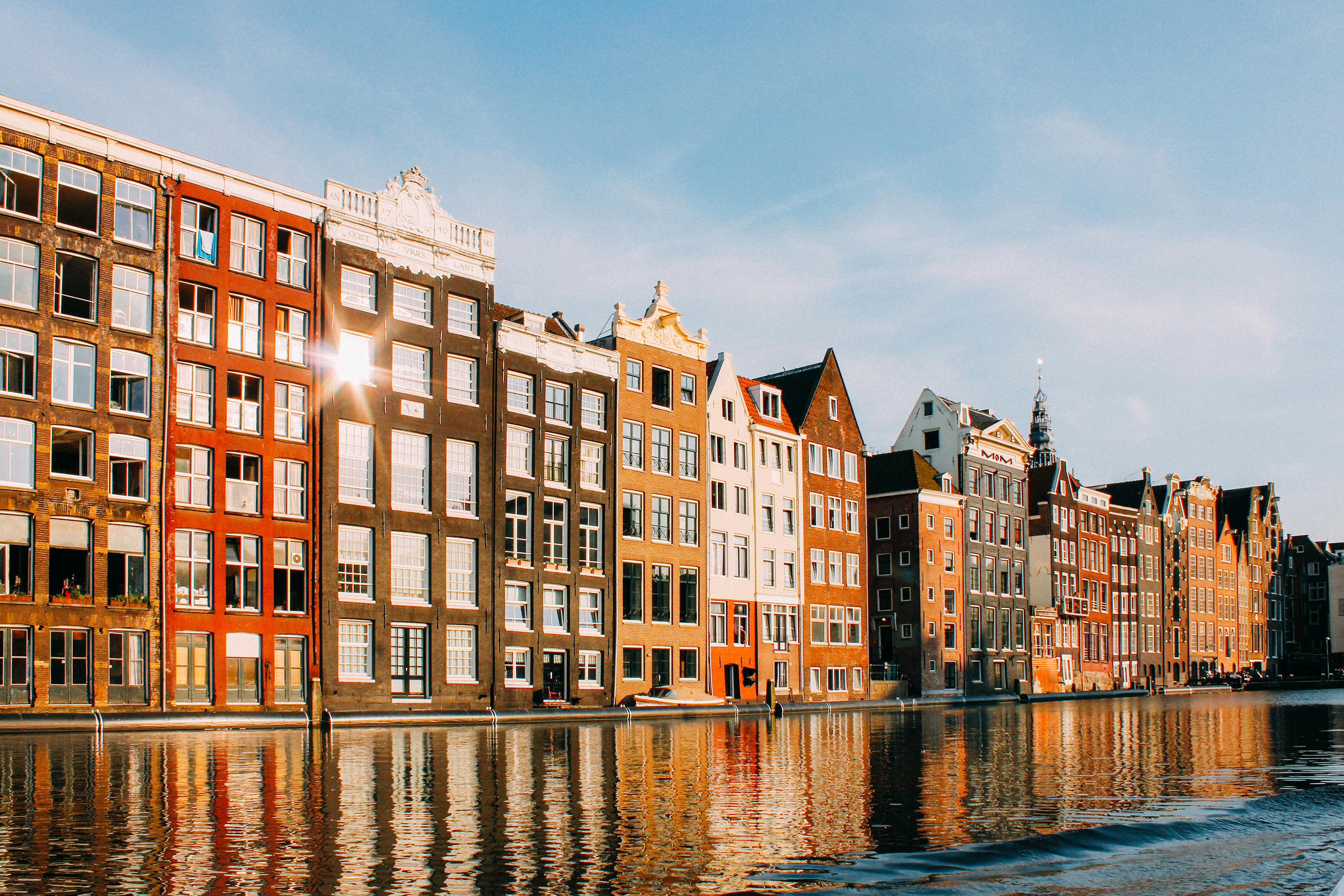 Buildings surrounding a river in the Netherlands.