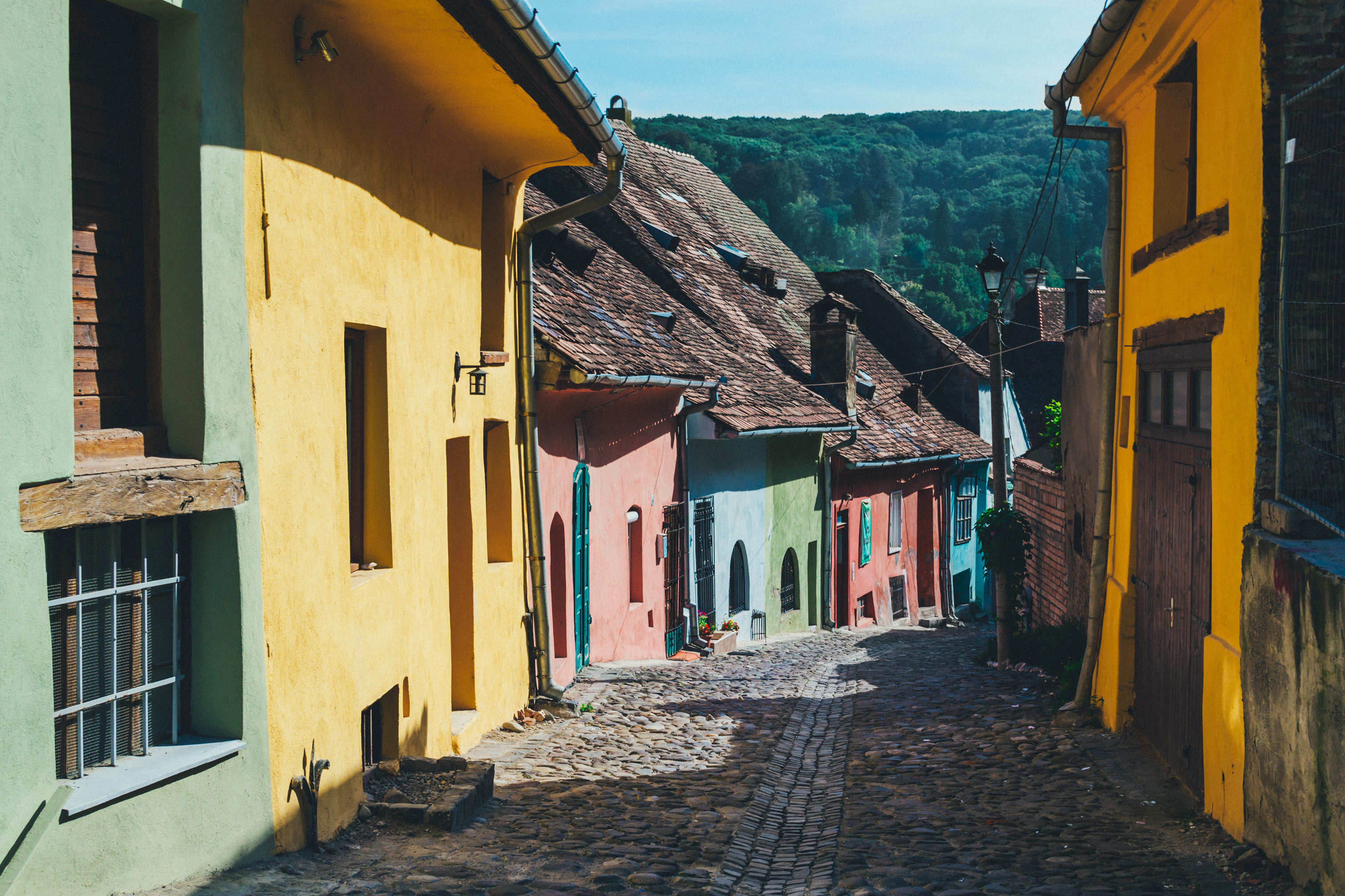 Colorful buildings on a street in Romania.